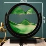 Oggetto decorativo in vetro con paesaggio montano, perfetto come decorazione scientifica o da scrivania, con dimensioni di 20x21 cm.