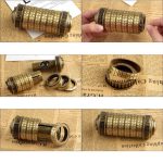 Cofanetto di cifrari scientifici vintage con rotelle numeriche e anelli di misurazione, perfetto come decorazione scientifica o oggetto da collezione.