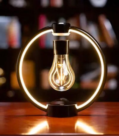 Lampada scientifica con luce a LED e struttura circolare, ideale come decorazione originale e oggetto di design per ambienti studi e uffici.