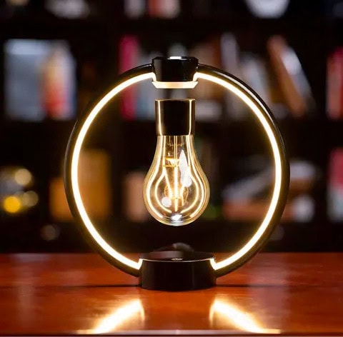 Lampada scientifica con luce a LED e struttura circolare, ideale come decorazione originale e oggetto di design per ambienti studi e uffici.