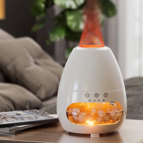 Diffusore di aromi con cristalli di sale rosa, luce calda e vaporizzatore, ideale per creare un'atmosfera rilassante e benefica in casa o in ufficio.
