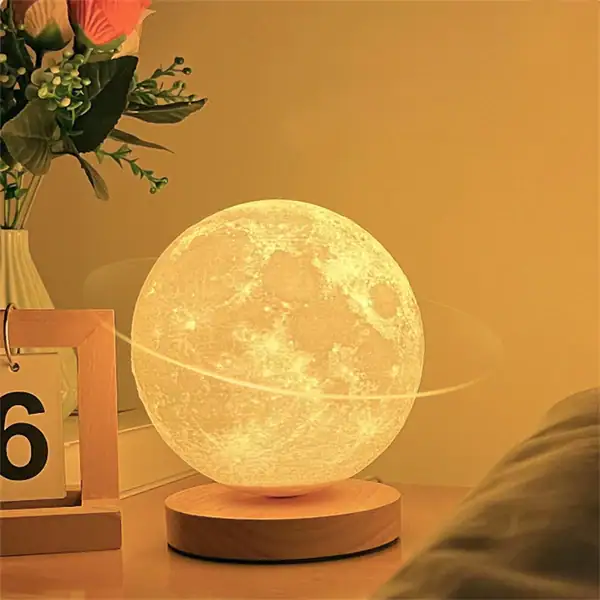 Lampada a forma di luna con luce calda, decorazione notturna per ambienti interni, ideale come luce da notte o elemento decorativo originale.
