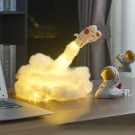 Modellino di razzo spaziale con effetti di fumo e luci LED.