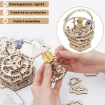 Modello di orologio meccanico in legno con ingranaggi e sfere colorate, perfetto per decorazioni scientifiche e stimolare la creatività. Facile da assemblare e ideale per appassionati di scienza.