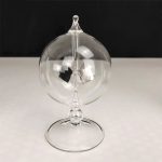 Orologio a pendolo in vetro trasparente con meccanismo interno visibile, decorativo e scientifico, ideale per appassionati di oggetti scientifici e decorazioni originali.
