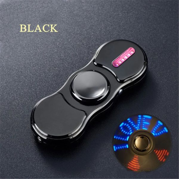 Spinner antistress nero con luci LED e pulsante rosa, ideale come decorazione scientifica o oggetto da scrivania, perfetto per rilassarsi e decorare ambienti moderni.