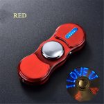 Spinner antistress rosso con luci LED blu integrate.