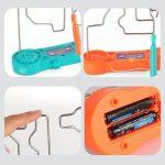 Gioco di destrezza con palline di metallo e labirinto in plastica colorata.