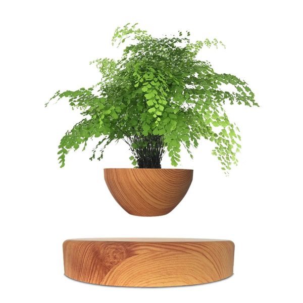 Pianta artificiale in vaso di legno con foglie verdi, decorazione naturale e moderna.