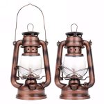 Due lanterne a olio vintage in rame con manico e vetro trasparente, perfette come decorazioni scientifiche o oggetti da collezione.