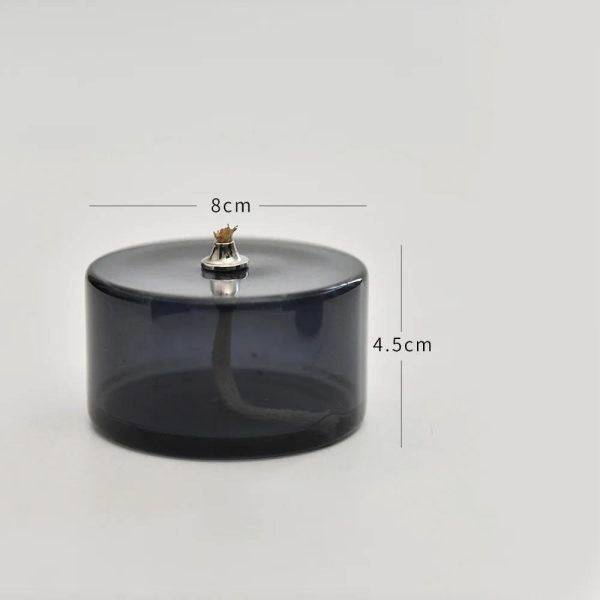 Contenitore in vetro nero con coperchio, ideale per decorazioni scientifiche e oggetti da collezione. Design elegante e funzionale, perfetto per ambienti di studio o esposizioni.
