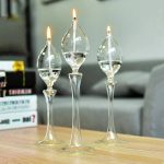 Luci decorative a forma di molecola di vetro con fiamma, perfette come decorazioni scientifiche e oggetti di design innovativi.