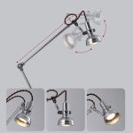 Luce da tavolo scientifica in stile vintage con braccio regolabile e lampada a incandescenza, perfetta come decorazione originale per ambienti di studio o ufficio.