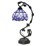 Lampada Tiffany con paralume in vetro colorato blu e viola, base in metallo nero, perfetta come decorazione scientifica o da tavolo elegante.