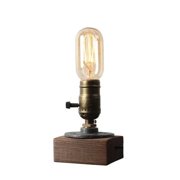 Lampada Edison vintage con filamento visibile e base in legno naturale, perfetta come decorazione originale e retrò per ambienti domestici o uffici.