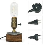 Lampada a filamento vintage con base in legno e spina elettrica, perfetta come decorazione scientifica o oggetto da collezione.
