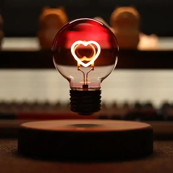 Lampadina decorativa con cuore luminoso, perfetta per ambienti scientifici e decorativi.