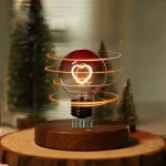 Lampada decorativa con cuore luminoso e effetti di luce rotanti, ideale come oggetto scientifico e decorativo.