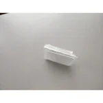 Strumento scientifico in plastica trasparente, utilizzato per esperimenti e dimostrazioni di laboratorio, posizionato su uno sfondo bianco.