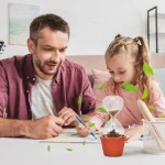 Padre e figlia che svolgono un esperimento scientifico in laboratorio, con strumenti e piante, in un ambiente luminoso e moderno.
