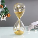 Clessidra decorativa con glitter dorato, perfetta come oggetto di design e decorazione scientifica, ideale per aggiungere un tocco elegante e originale agli ambienti.