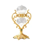 Oggetto decorativo in vetro e oro, ispirato a strumenti scientifici antichi, perfetto come decorazione elegante e originale.