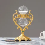 Vaso decorativo con base dorata e dettagli in stile barocco, con due sfere di vetro trasparente e ornamenti eleganti, perfetto come oggetto di decorazione scientifica o da collezione.