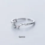 Anello elegante con simbolo zodiacale Gemelli, decorato con pietre brillanti, perfetto come regalo o accessorio di stile.