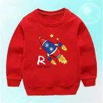 Maglietta rossa con stampa di un razzo e la lettera B, perfetta per i piccoli appassionati di scienza e spazio. Design colorato e divertente, ideale per stimolare la curiosità dei bambini.