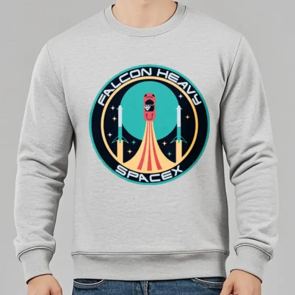 Felpa grigia con stampa Falcon Heavy SpaceX, logo di un razzo che decolla, ideale per appassionati di spazio e tecnologia.
