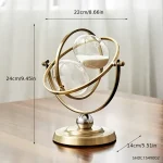 Oggetto decorativo a forma di atomo con sfere di vetro e struttura metallica dorata, ideale come decorazione scientifica elegante per ambienti moderni.
