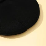 Pietra filosofale in pietra nera, oggetto decorativo scientifico, con superficie liscia e lucida, perfetta per collezioni o decorazioni a tema scientifico.