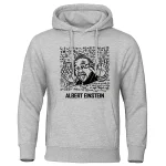 Felpa grigia con stampa di Albert Einstein che fa il gesto di "stop" con le mani, circondata da formule matematiche e scientifiche. Ideale per appassionati di scienza e cultura scientifica.