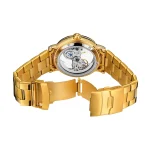 Orologio femminile di lusso con cinturino in oro e movimento visibile attraverso il quadrante trasparente.