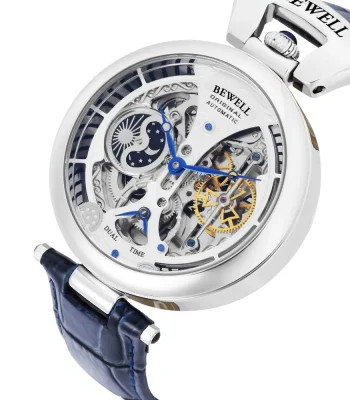 Orologio skeleton automatic con movimento visibile, cassa in acciaio e cinturino in pelle blu, perfetto come decorazione scientifica e oggetto di design innovativo.
