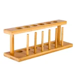 Supporto in legno con fori e supporti in bambù, ideale per esperimenti scientifici e attività di laboratorio. Design naturale e resistente, perfetto per uso didattico e decorativo.