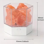 Salgemma rosa dell'Himalaya in contenitore trasparente.