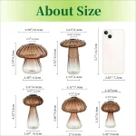 Pezzi di funghi decorativi in vetro con dettagli di dimensioni e altezza, ideali per decorazioni scientifiche o da collezione.