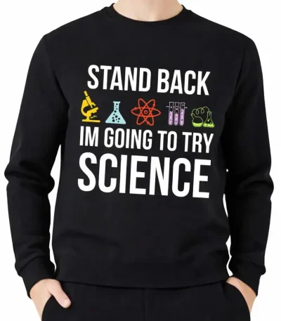 Una giacca con cappuccio nera con il testo "Stand Back, I'm Going to Try Science" e icone di laboratorio colorate, ideale per gli appassionati di scienza e di decorazione scientifica.